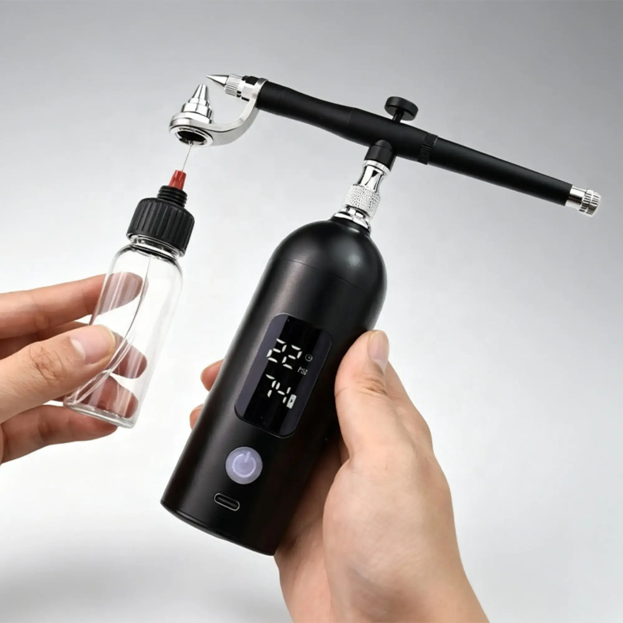 professional-cordless-airbrush-compressor-kit-with-led-display-in-hands.webp